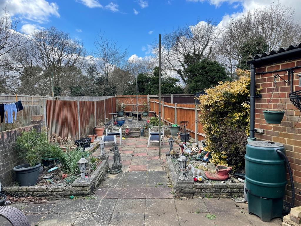 Lot: 45 - TWO-BEDROOM END-TERRACE HOUSE - Rear paved back garden with side access and storage shed